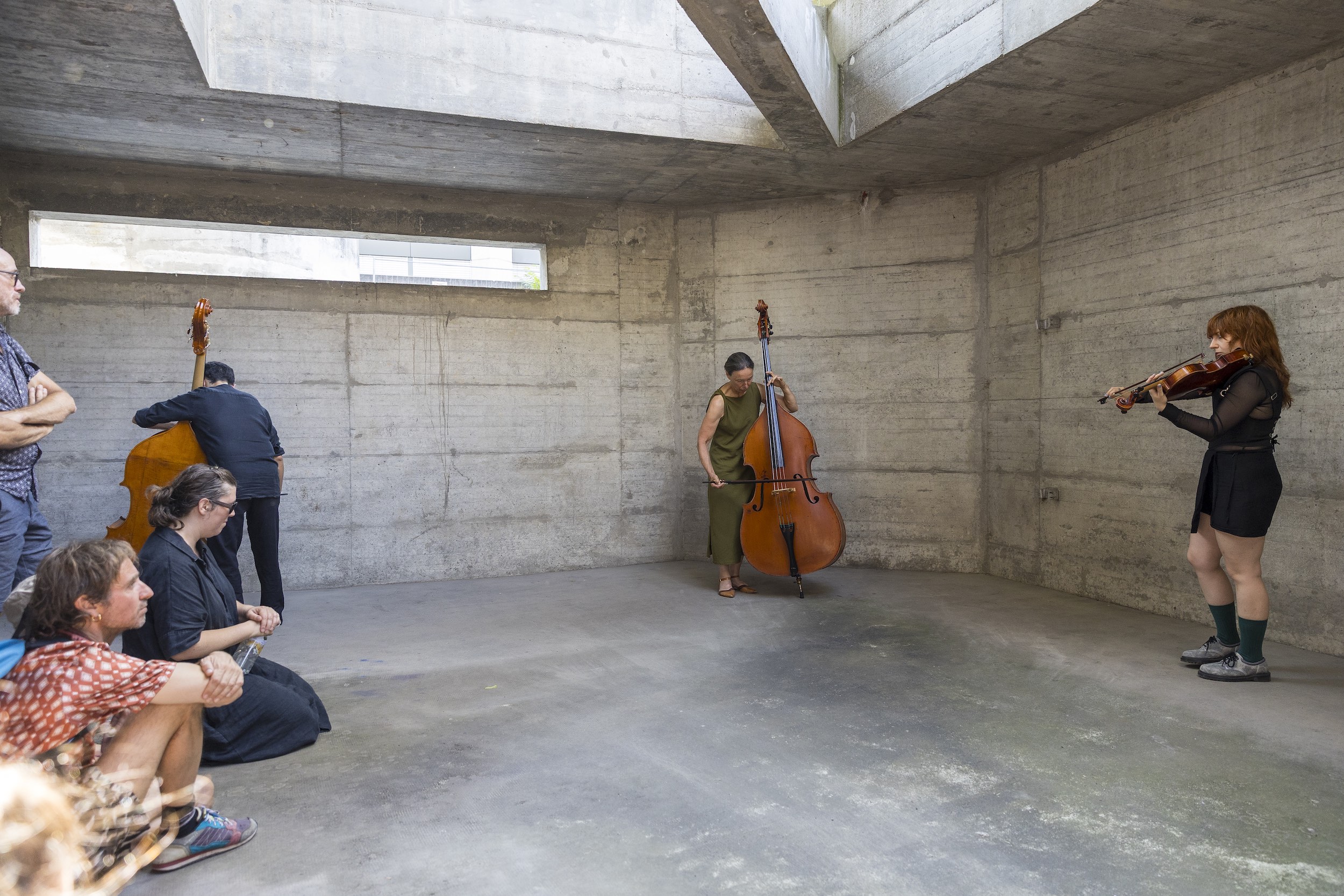 Performance documentation of more heat than light by LABOUR (Farahnaz Hatam & Colin Hacklander) at Pavillon Siclin Geneva 2